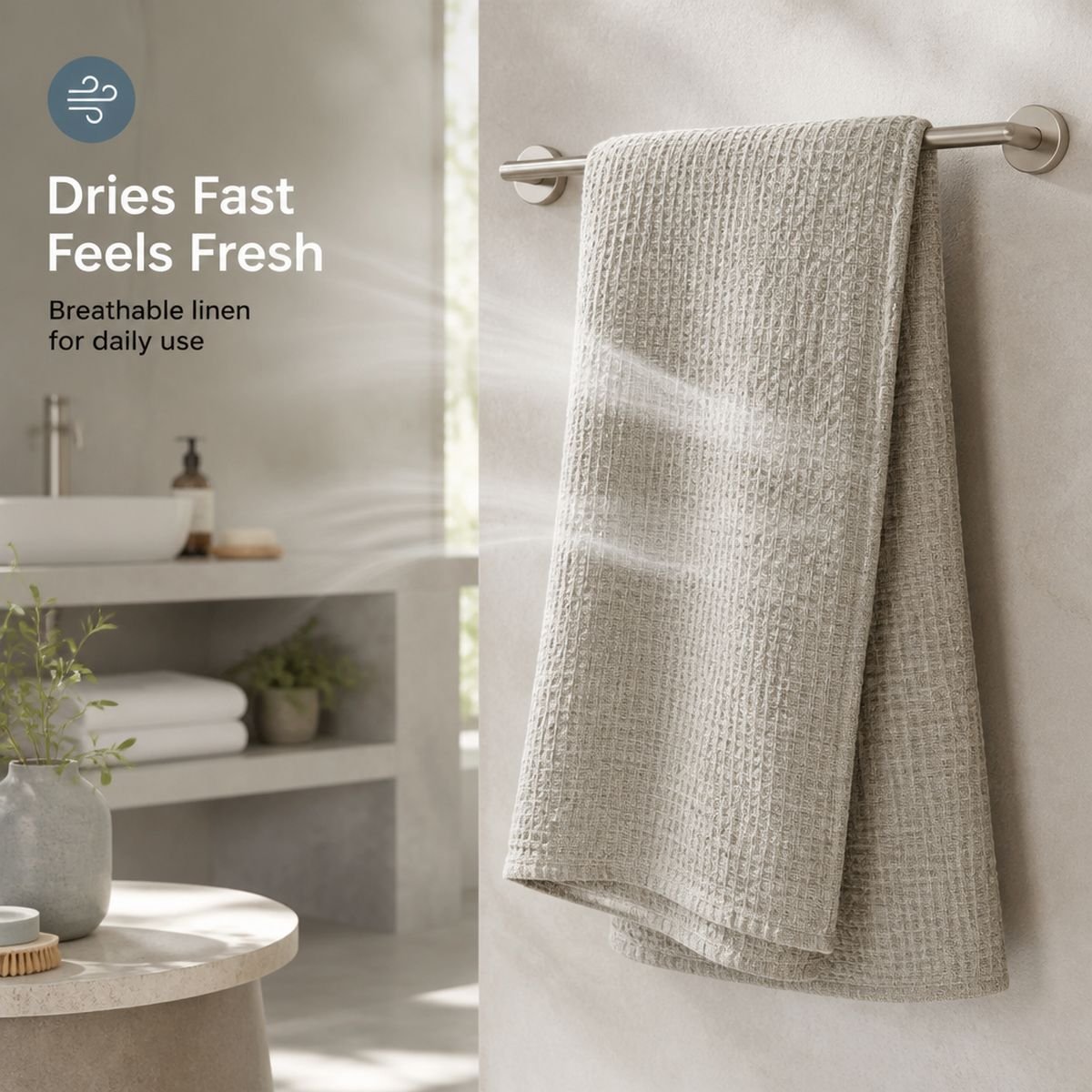 Dries fast and feels fresh: breathable linen bath sheet hanging on a rail in a sunlit bathroom